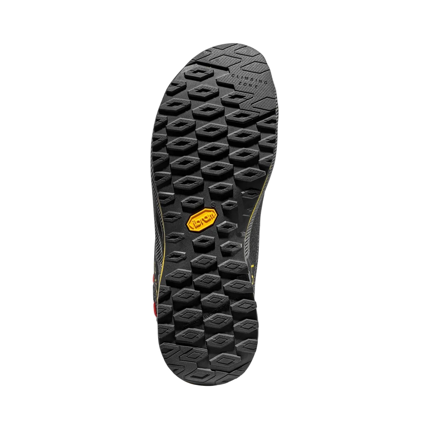 Close-up of a black shoe sole with a yellow logo on a light gray background